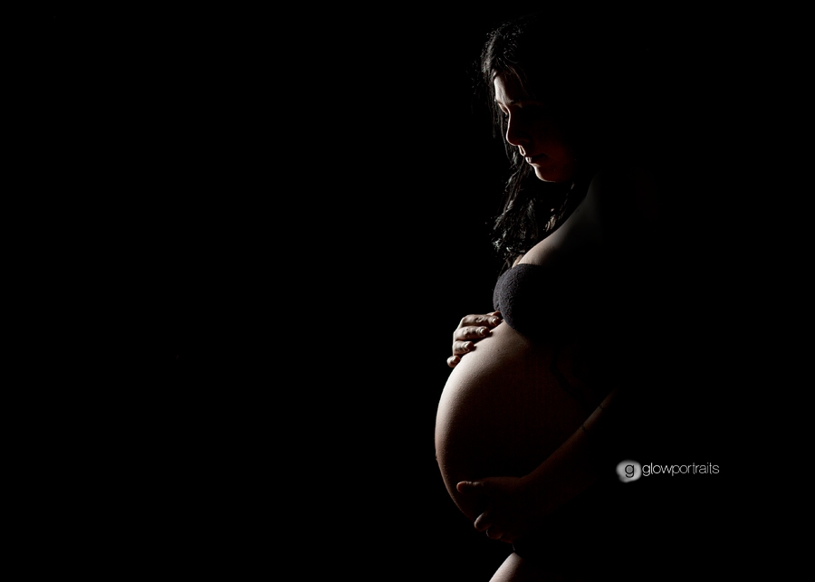 black silhouette maternity pose