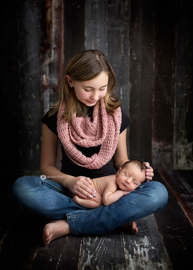 sister holding baby brother