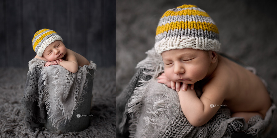 baby in metal bucket with gray yellow bonnet