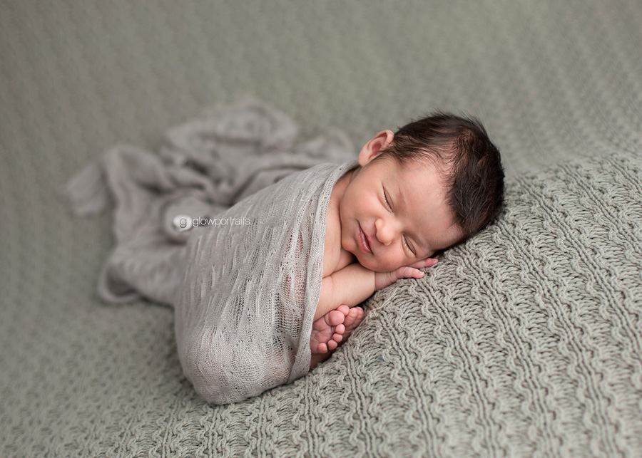 newborn girl wrapped in fabric